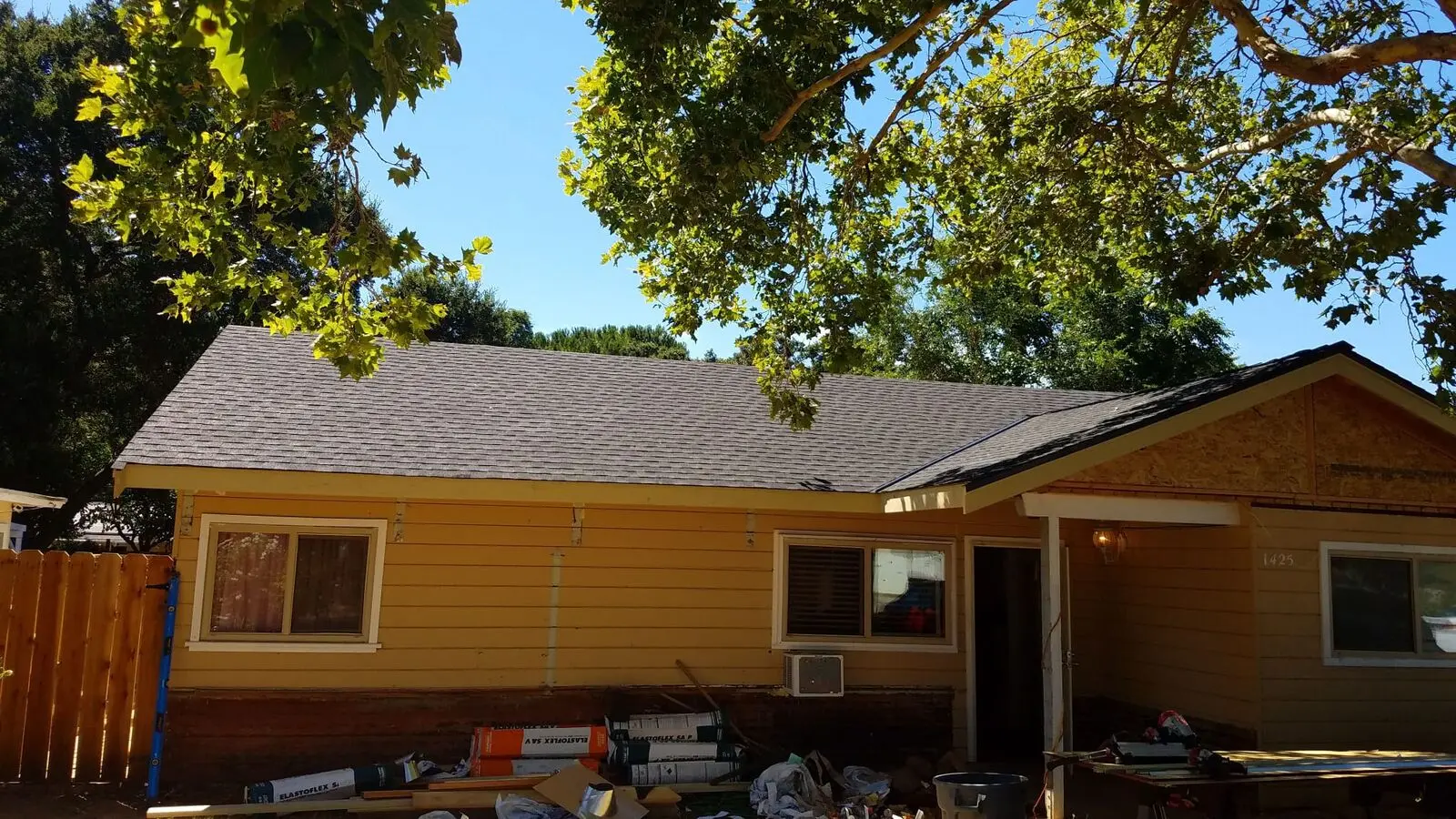 Completed Shingle Roof Section Yellow House